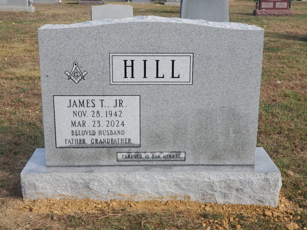 companion monument with masonic symbol