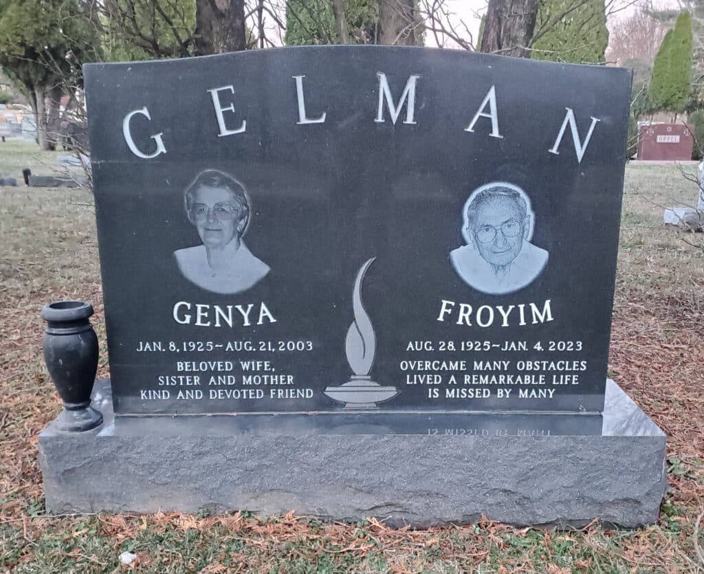 Jewish monument with etched portraits on black granite