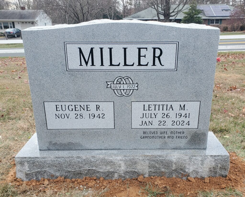 companion headstone with wedding rings design