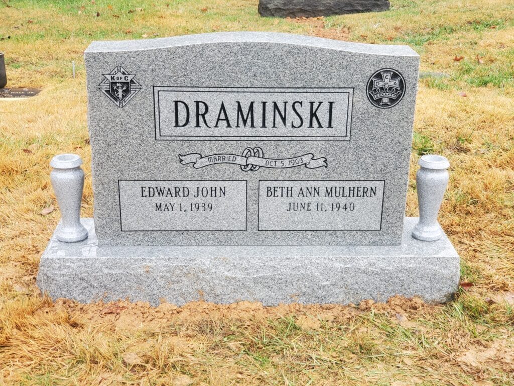 gray companion monument with custom club emblems