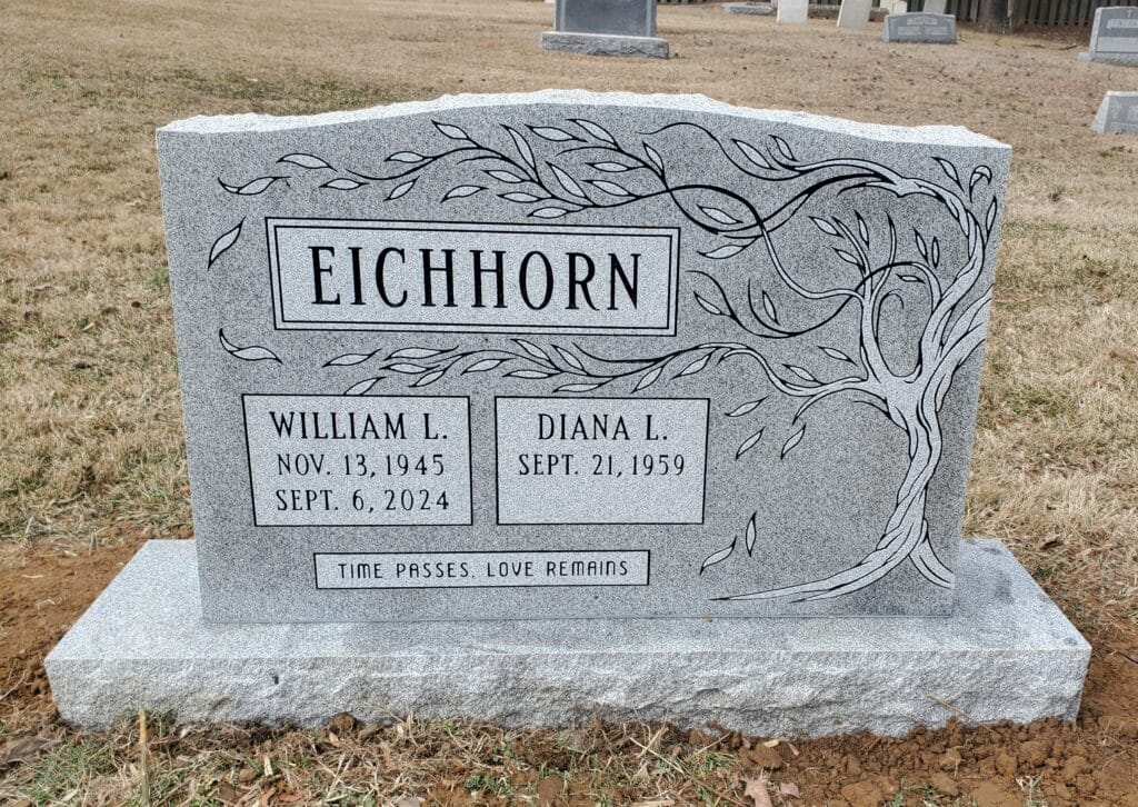 Companion headstone with shared surname and decorative tree
