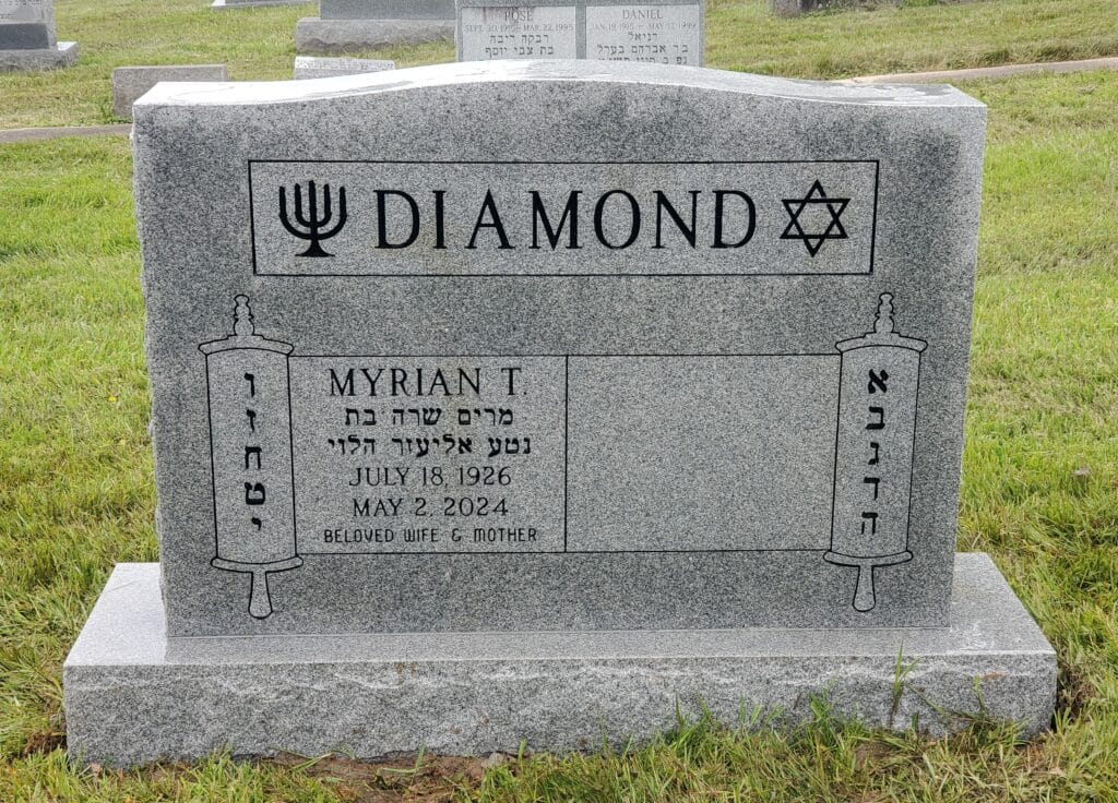 Upright companion headstone with custom scroll panel and Jewish symbols