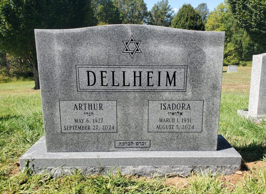 Jewish Granite double headstone featuring simple border and shared surname