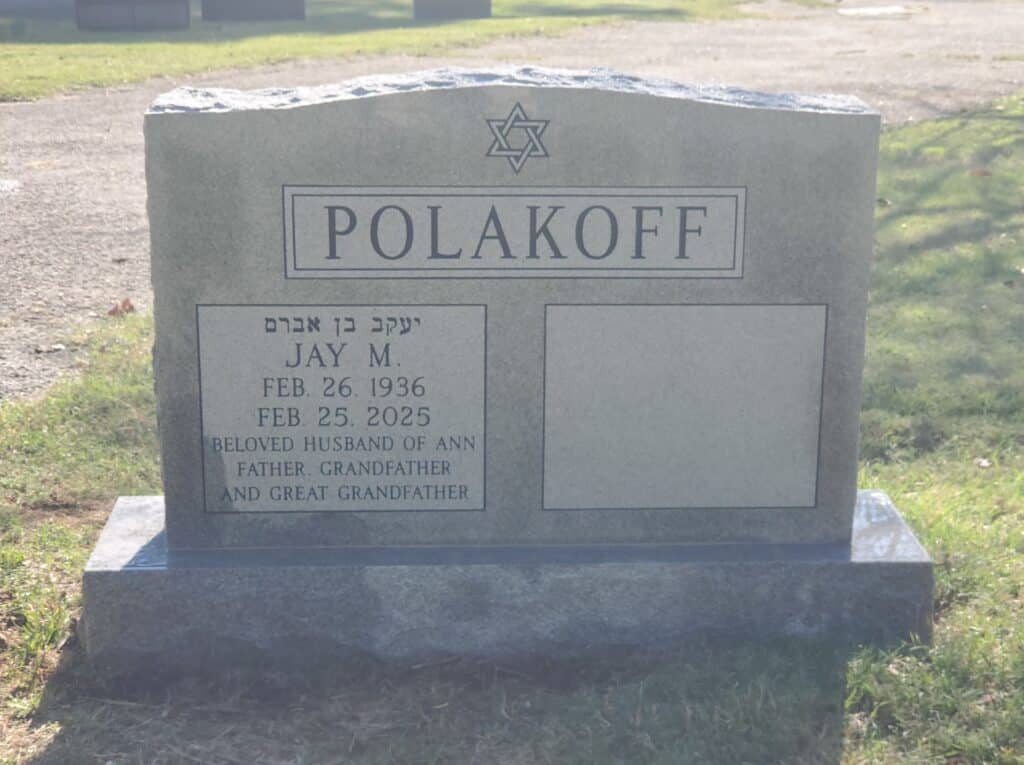 Jewish Granite double headstone featuring simple border and shared surname